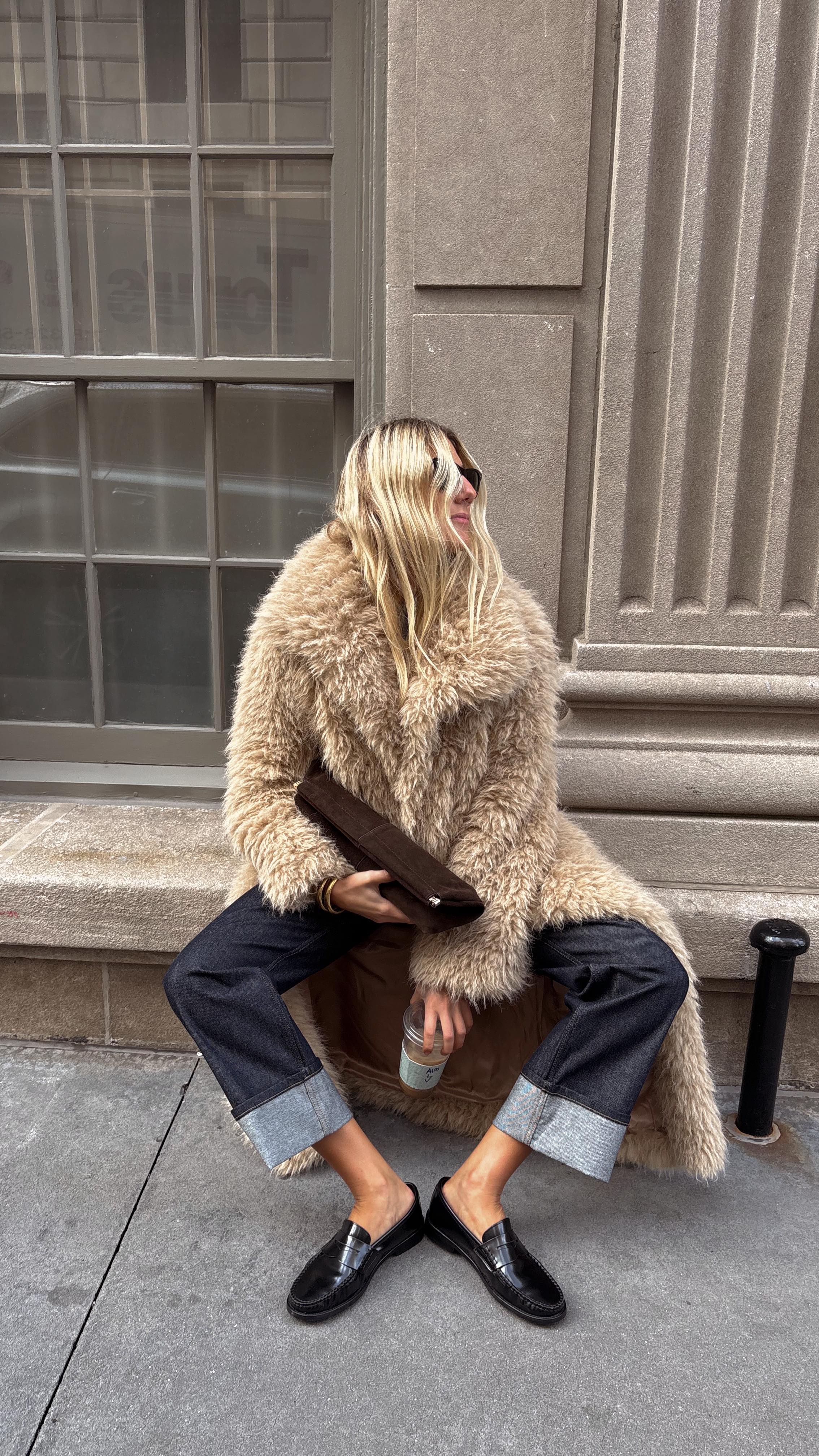 Instagram post by an influencer for Mango. Caption reads: [...] in my armor for iced lattes ☕️ @mango....