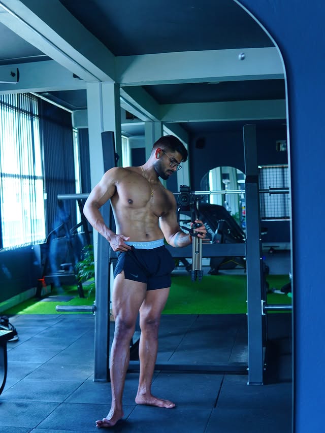 Instagram post by @fit_mrutyunjay for Optimum Nutrition. Caption reads: Flexing with purpose💪🤭 . . Follow....