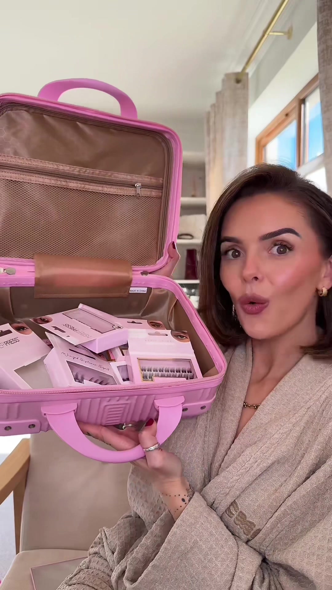 TikTok post by @stephanievavron for TATTI LASHES. Caption reads: 50% off this gorgeous vanity case bundle filled....