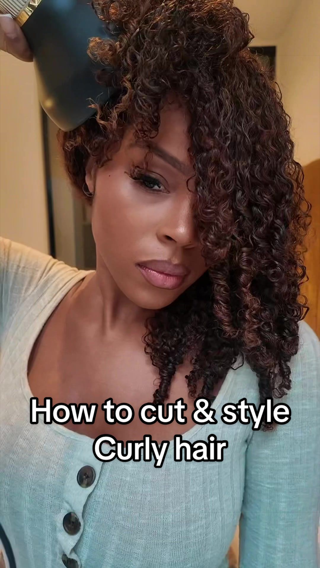TikTok post by @jazzminemaria for OQ HAIR WIG. Caption reads: [...] Tutorial for curly hair cutting 🫶🏾 @OQ....
