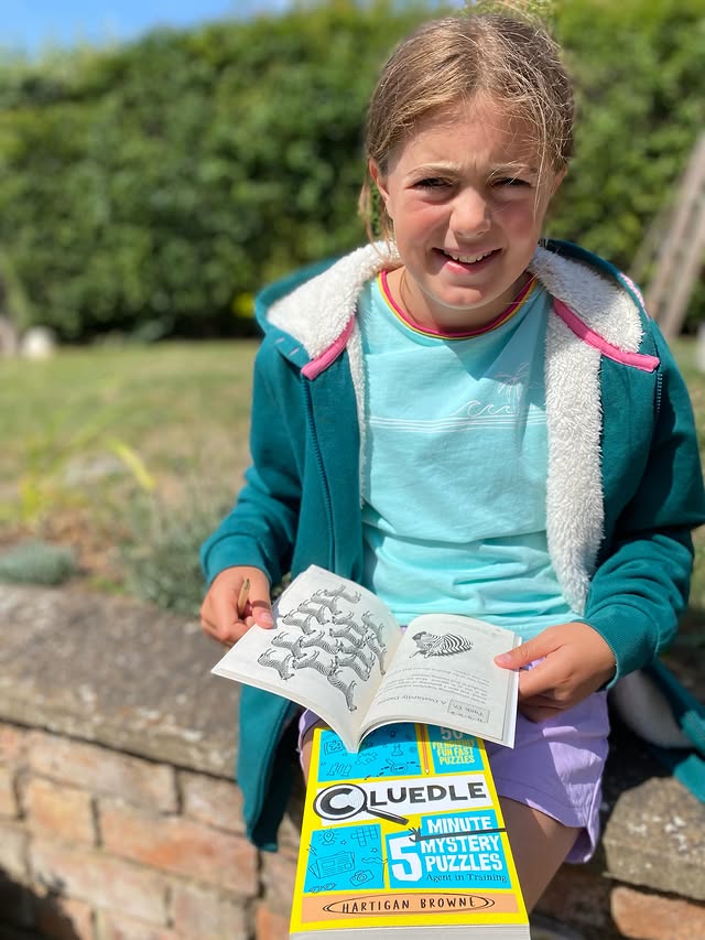 Instagram post by @justanormalmum_ for Pan Macmillan. Caption reads: [...] and these Cluedle books from @panmacmillan....