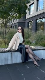 Instagram post by @marija_jansone for Apranga Group. Caption reads: Wearing my beiges, but making a statement.....