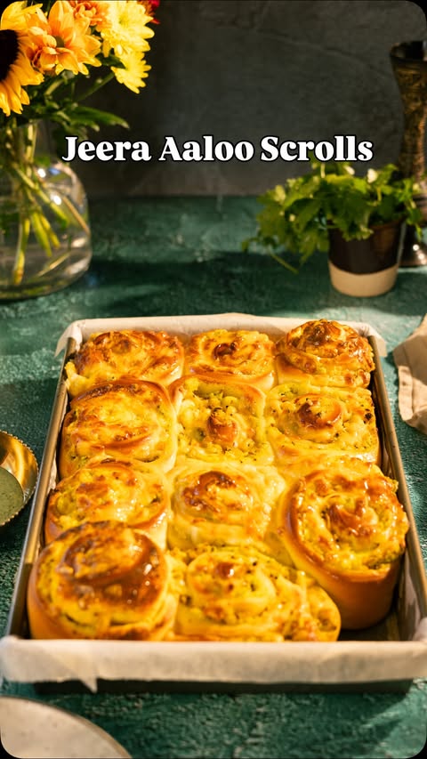 Instagram post by @adventureswithsugar for Le Creuset. Caption reads: Recipe Alert 🚨 Jeera Aaloo Scrolls This pillowy,....