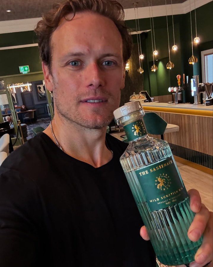 Instagram post by @samheughan for Sassenach Spirits. Caption reads: [...] @cairndalehotelspa 🙌 Now serving....