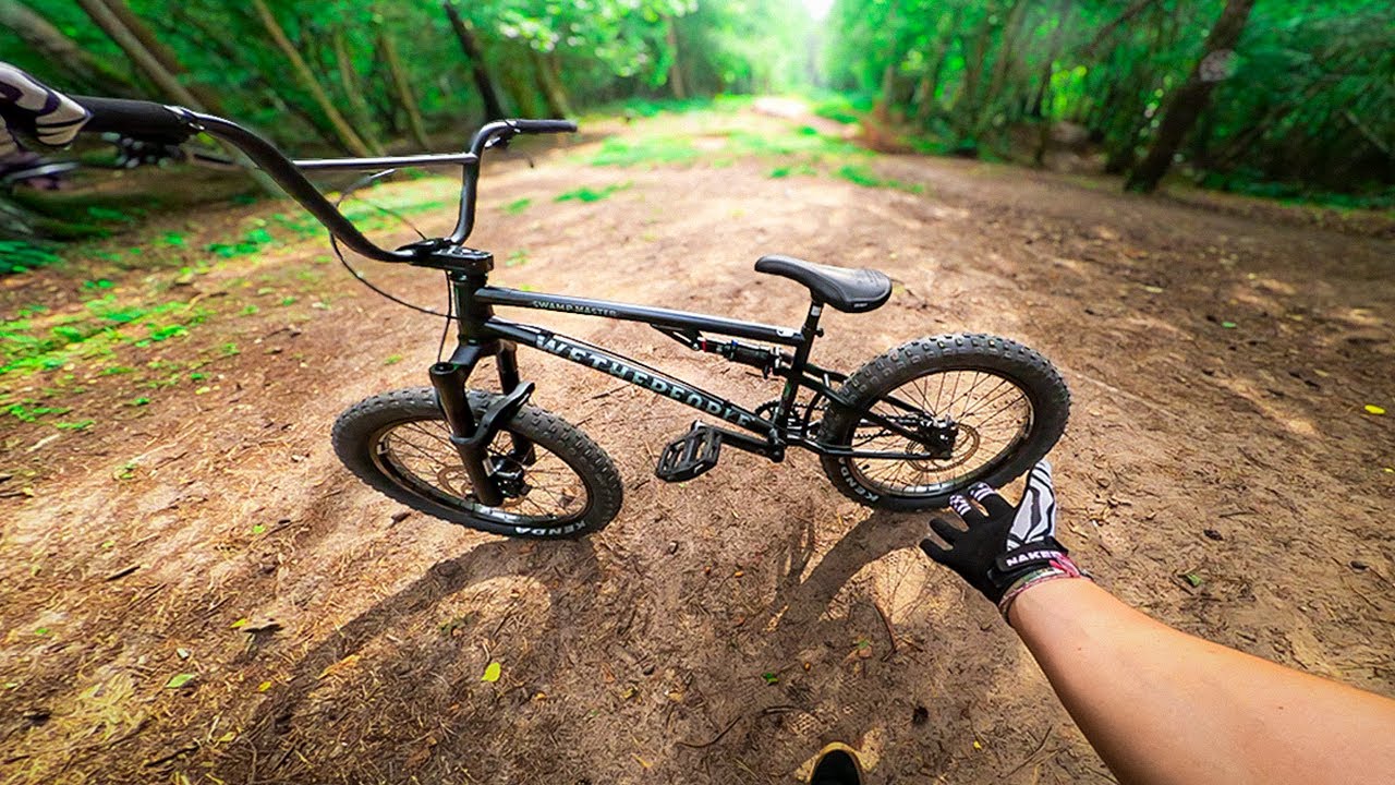 YouTube post by @TodayWeRideGlobal for NAKED Optics. Caption reads: Full Suspension BMX - Full Send POV!.