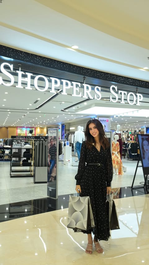 Instagram post by @allabout_eshaa for Shoppers Stop. Caption reads: [...] discover your exclusive benefits at Shoppers....