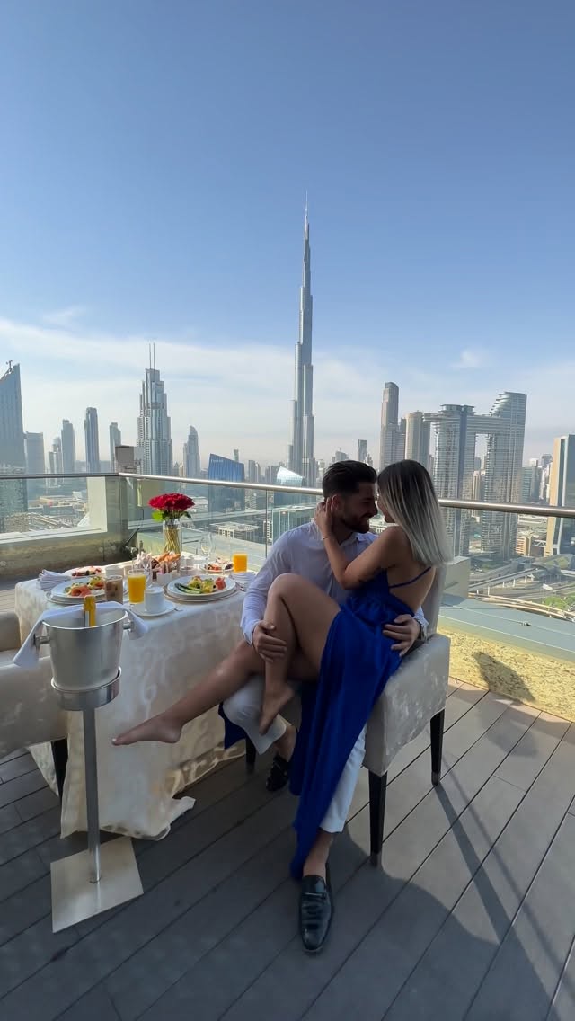 Instagram post by @travelwithsandm for Visit Dubai. Caption reads: Breakfast with the world’s tallest view 🏙️☕️....