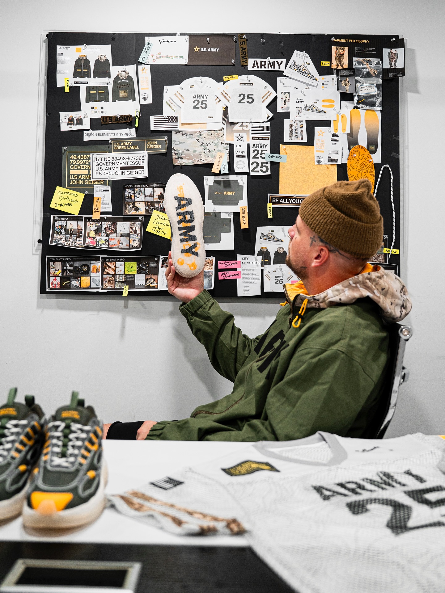 Instagram post by @johngeiger_ for GoArmy. Caption reads: Honored to be the first designer to collaborate....