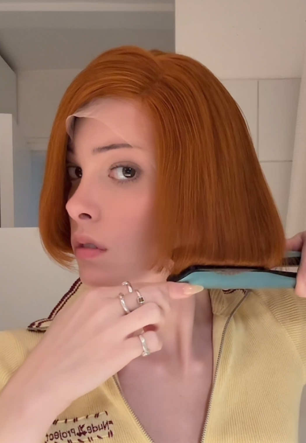 TikTok post by @thegigigoode for Acne Studios. Caption reads: Getting my hair together for @acnestudiosofficial .