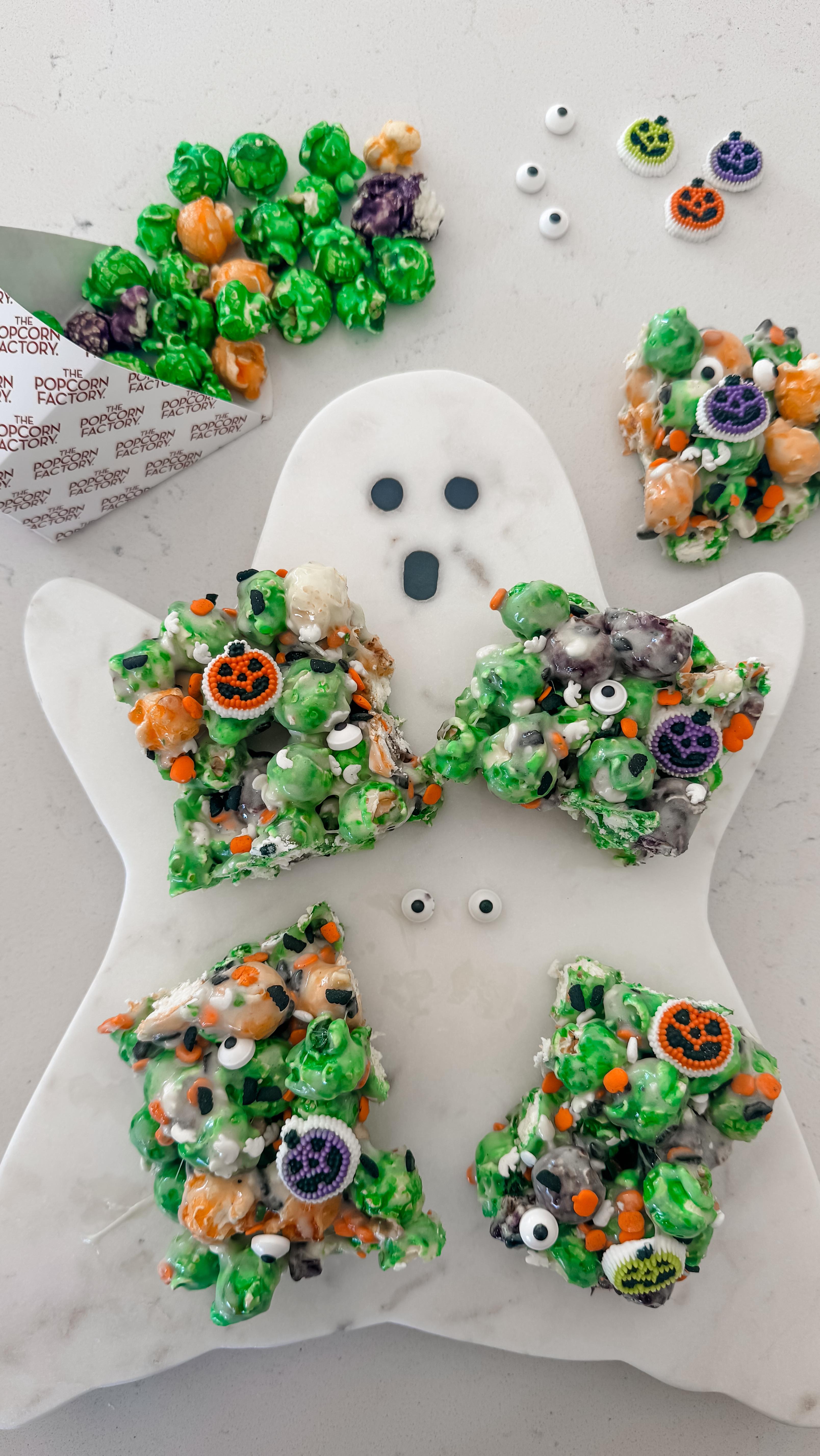 Instagram post by @k.neeekola for The Popcorn Factory. Caption reads: 🎃 Made these gooey Halloween Marshmallow Popcorn....