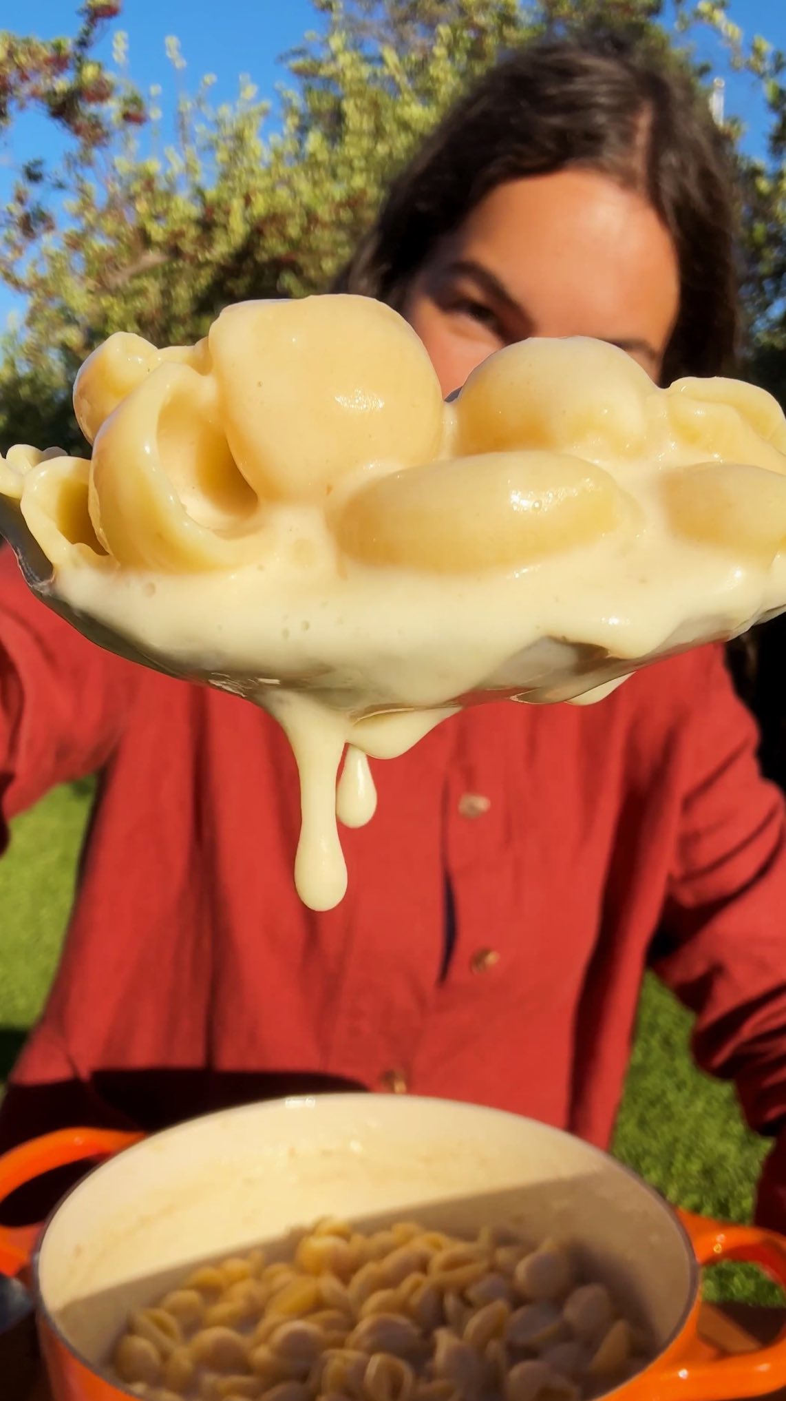 Instagram post by @carolinagelen for NYT Cooking. Caption reads: ONE-POT ROASTED GARLIC PASTA — packs the rich and....