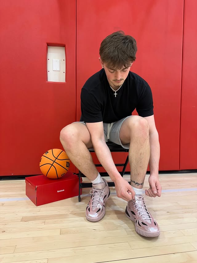 Instagram post by @connoressegian for Reebok. Caption reads: Laced up and locked in. #AngelReese1 @reebok....