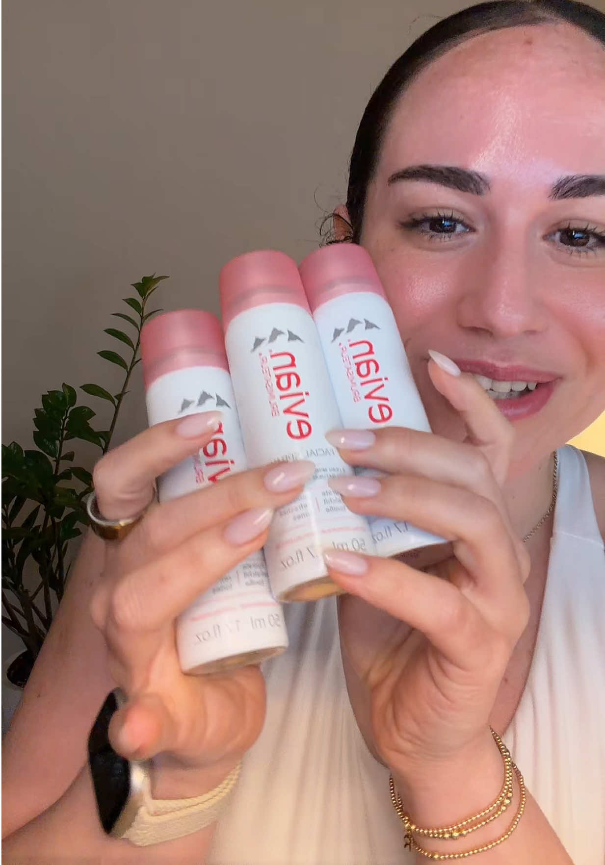 TikTok post by @viviendoconrae for Evian Facial Spray USA. Caption reads: We all need to stay hydrated during our....