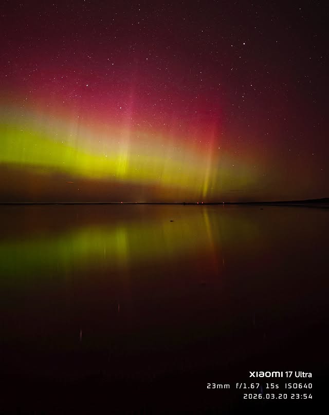 Instagram post by @egonslacis for Xiaomi Latvia. Caption reads: 🌌 Ziemeļblāzmas deja Jūrmalas nakts debesīs |....