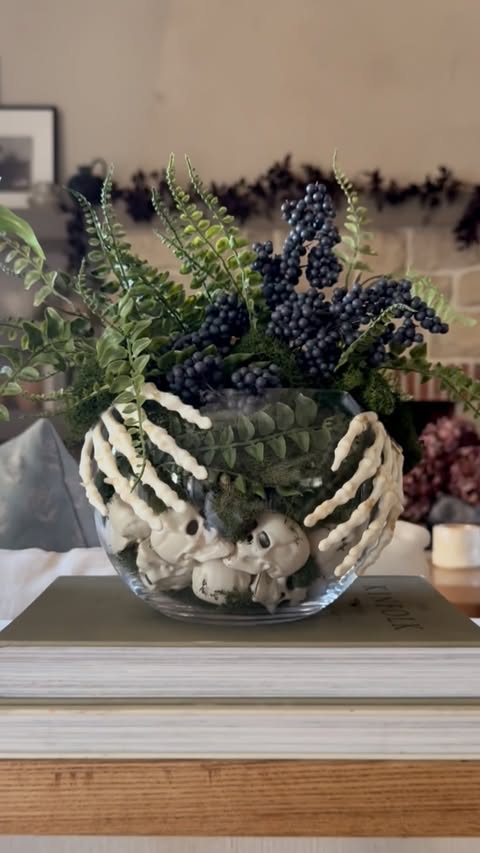 Instagram post by @mintandpinehome for Michaels Stores. Caption reads: [...] skull & skeleton hand terrarium at....