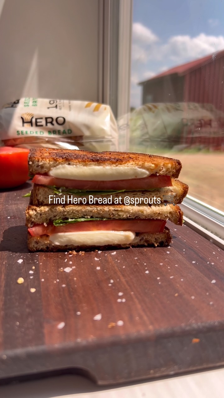 Instagram post by @farmacyrevolution_ for Hero Bread. Caption reads: Tomato sandwich 🍅🥪

It’s Grocery Trip Tuesday at....