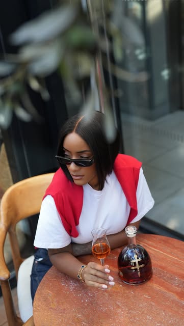 Instagram post by @simplicityxstyle for D'USSE Cognac. Caption reads: Paris, courtesy of @dussecognac 🇫🇷🥃 JAŸ-Z 30, a....