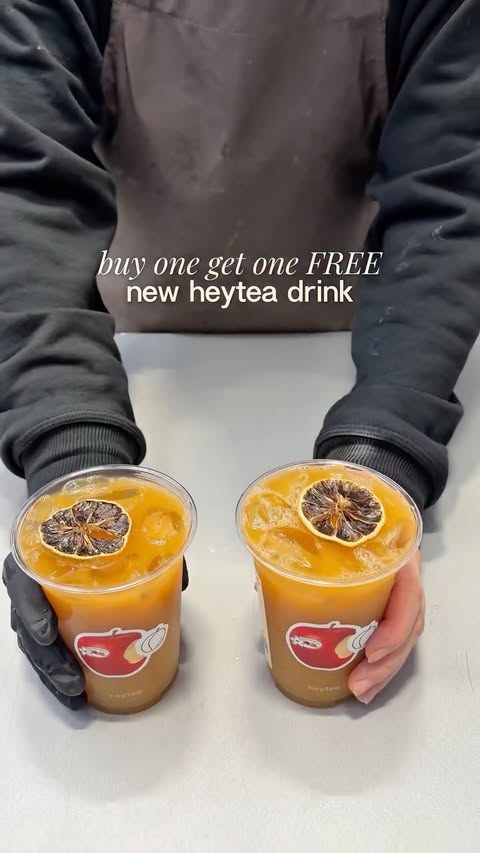 Instagram post by @eatswithclaire for HEYTEA. Caption reads: Buy one get one FREE @heytea.au’s new Qilan Apple....
