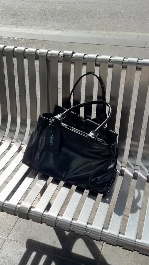 Instagram post by an influencer for Redken. Caption reads: [...] on-the-go, this is for you. 🖤 Redken pop-up....