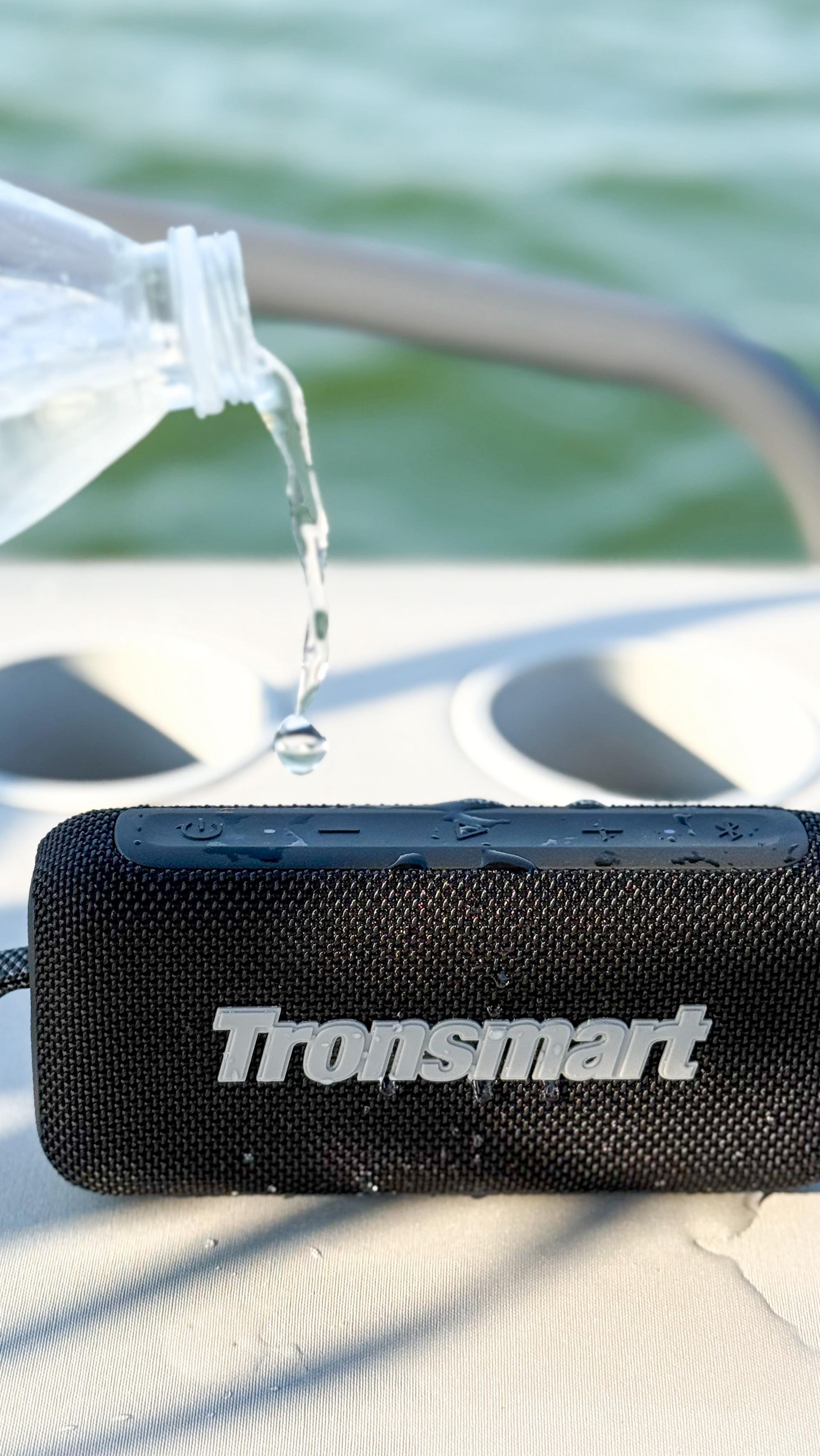 Instagram post by @kerraezgi for Tronsmart. Caption reads: #ad Taking the vibes out on the water 🎶🚤☀️....