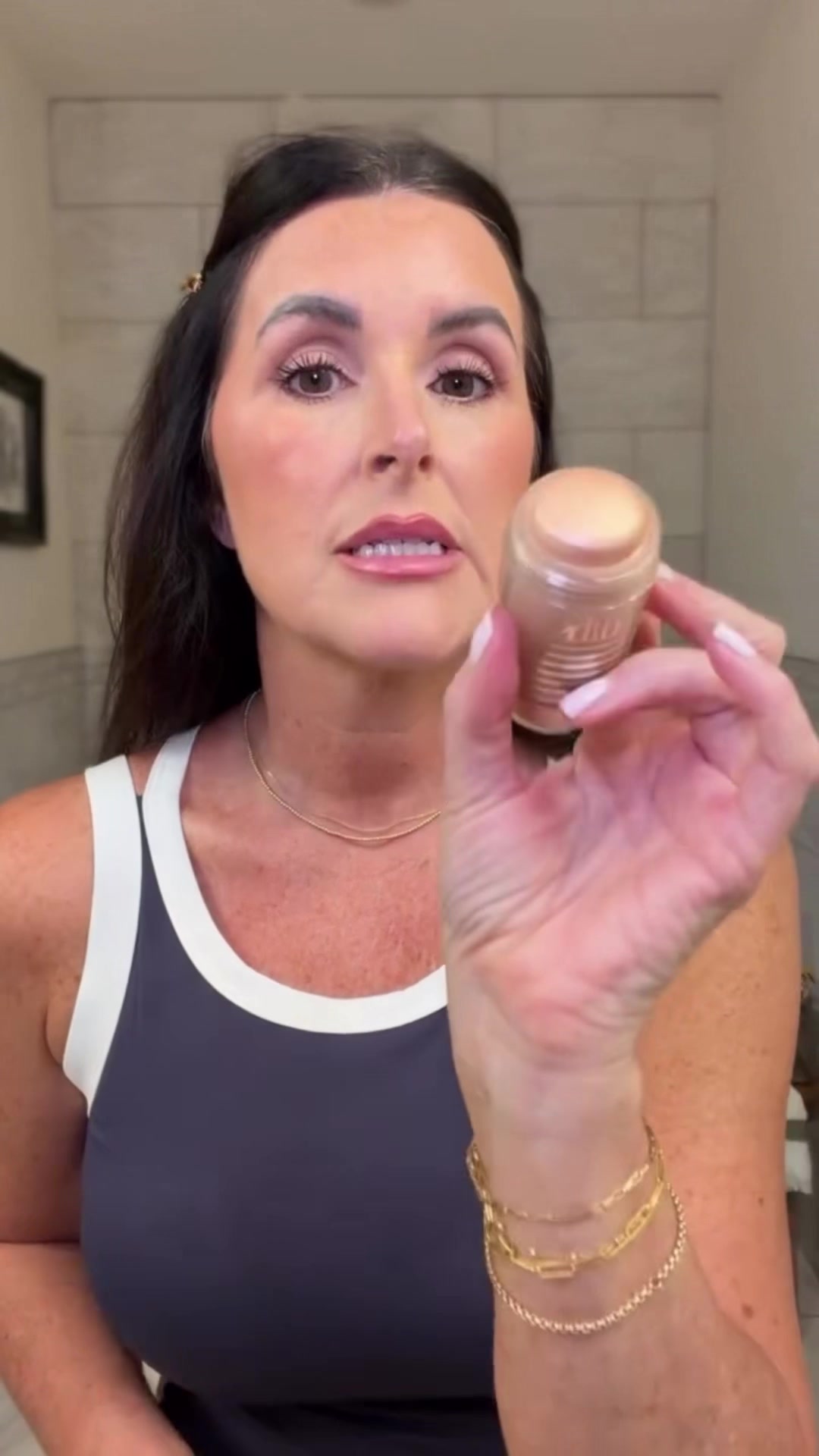 TikTok post by @angiehaughton for DIBS Beauty. Caption reads: [...] and body. it’s the prettiest shimmer....