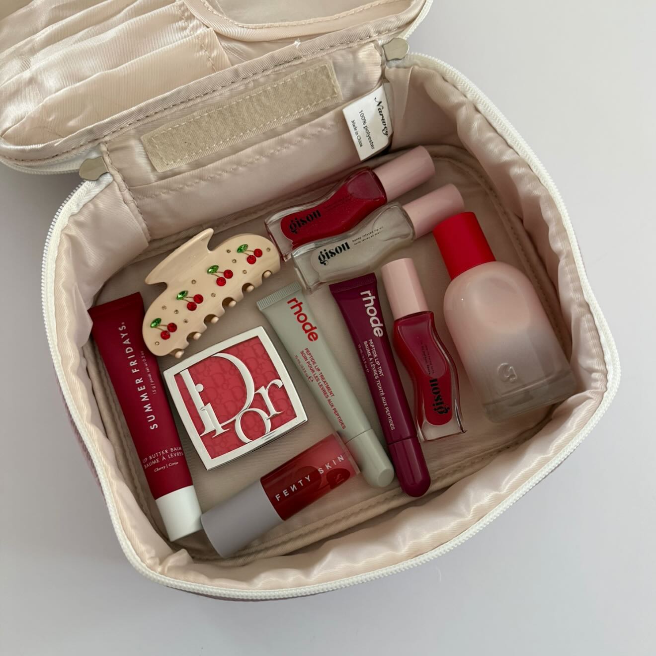 Instagram post by @carrieanne_ for Summer Fridays. Caption reads: berry beauties 🍒🍇🍓

a few berry faves in my....