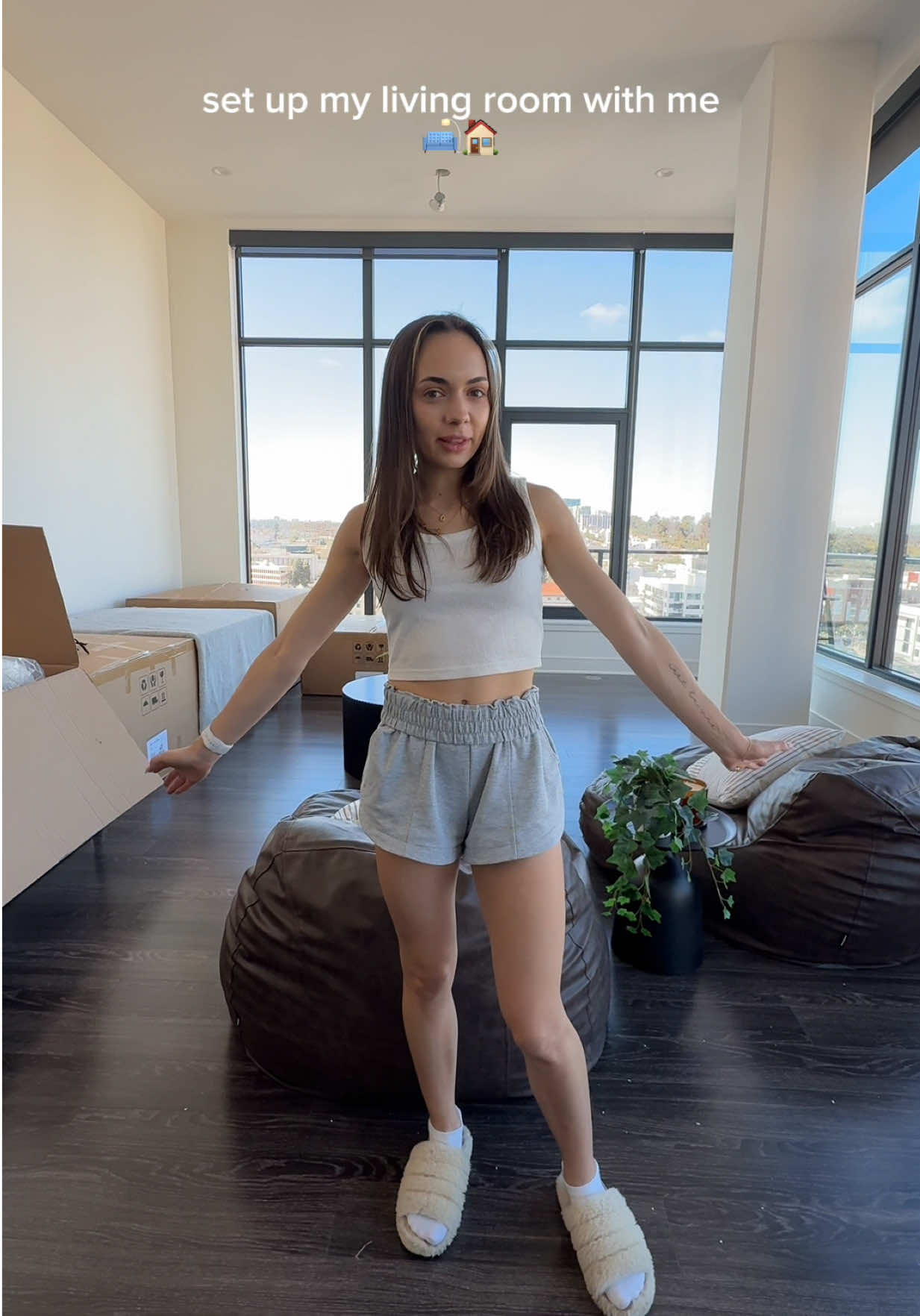 TikTok post by @laneygrn for Revival Rugs. Caption reads: [...] #newapartment #livingroomdecor #revivalrugs....