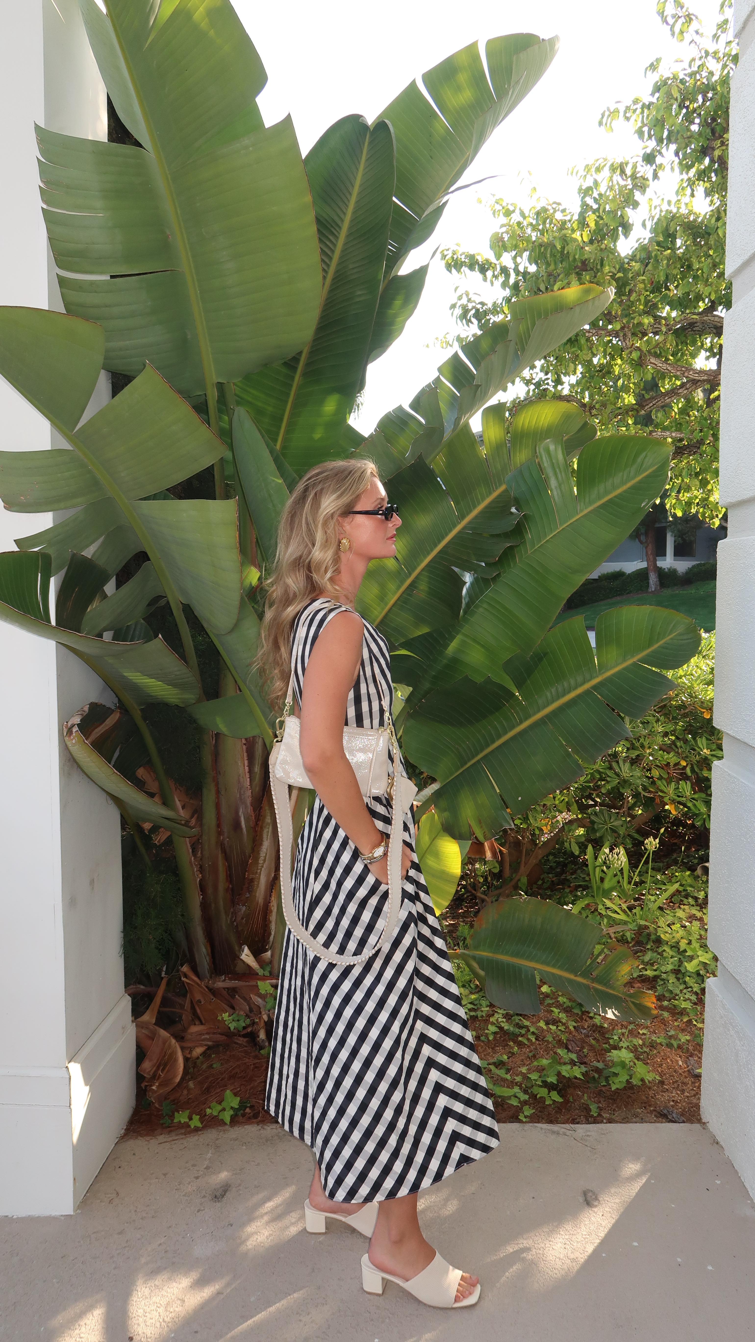 Instagram post by @whimzylindzy for HOBO. Caption reads: [...] & nothing but lipgloss in my purse....