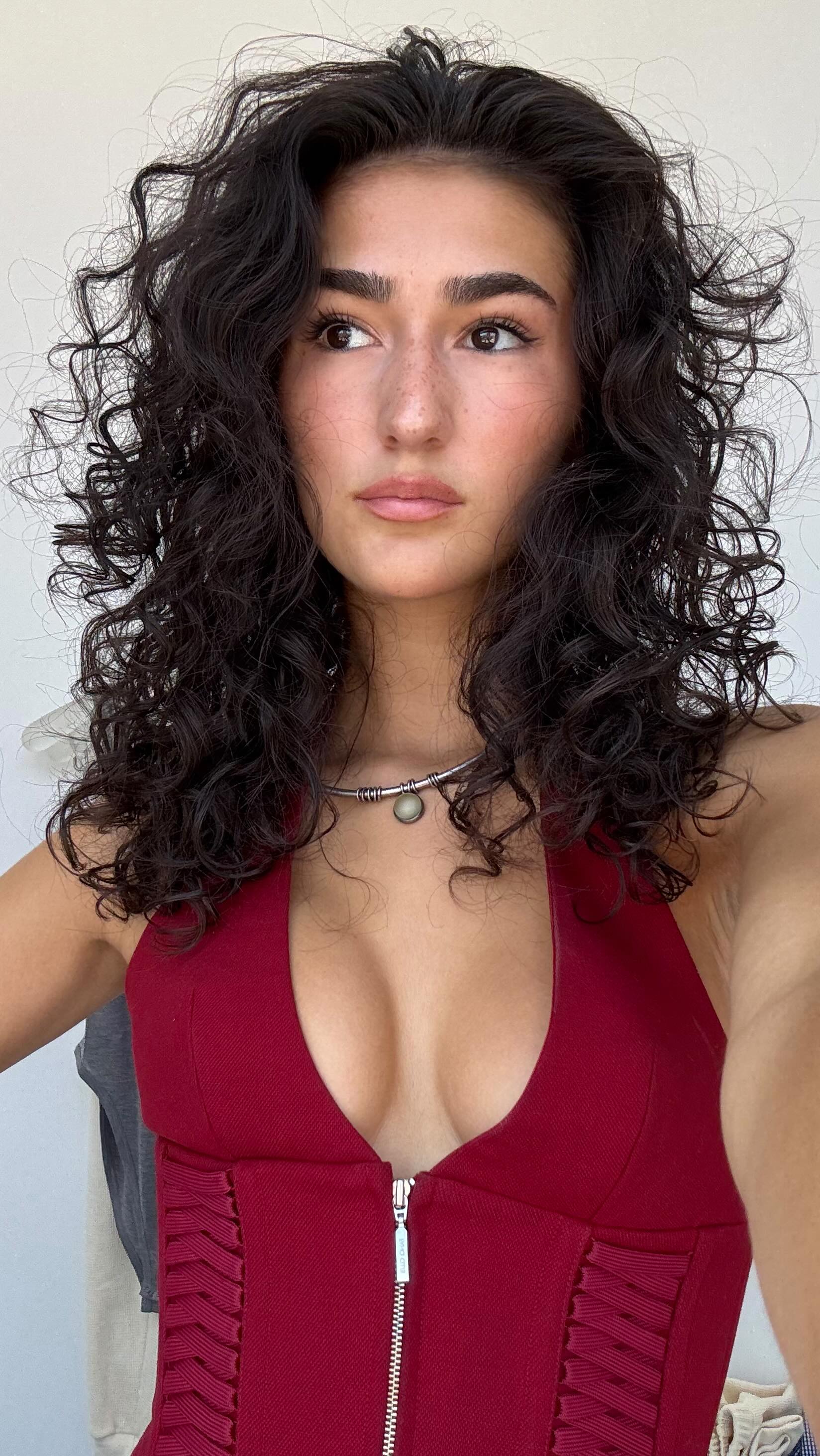 Instagram post by @corinnecll for Ouidad. Caption reads: I’ve been getting so many compliments on my curls....