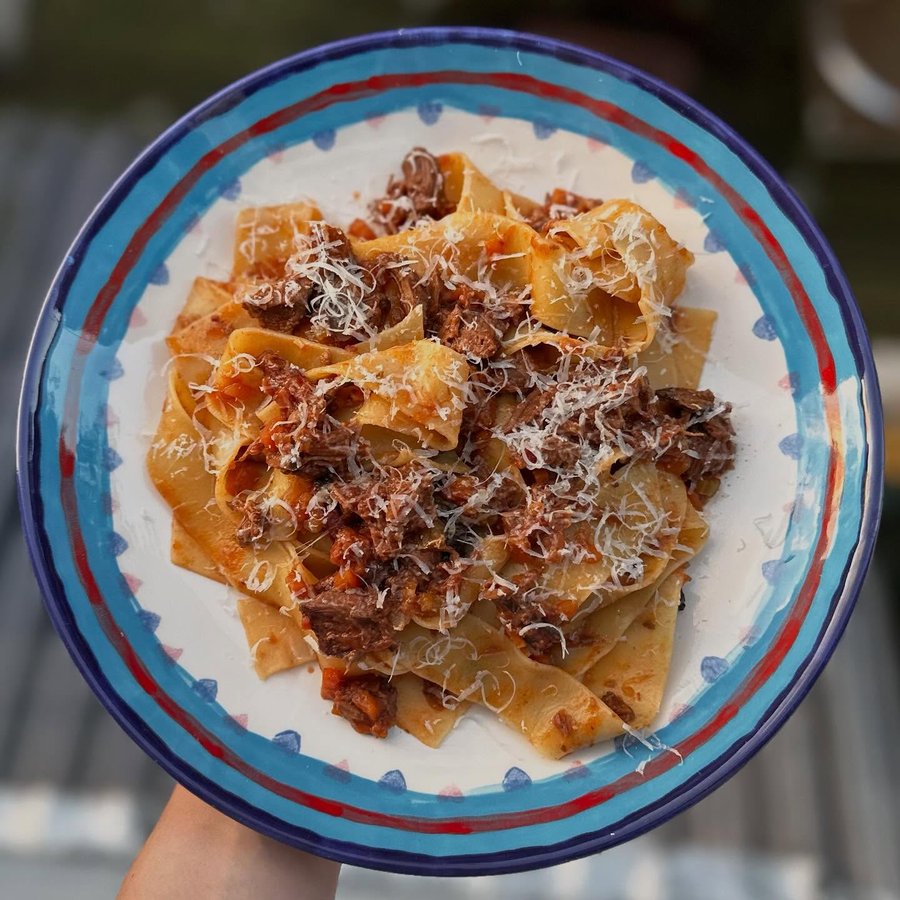 Instagram post by @mellsnosh for Pottery Café. Caption reads: Slow cooked beef ragù 🍝 Dinner tonight slapped 🤤....
