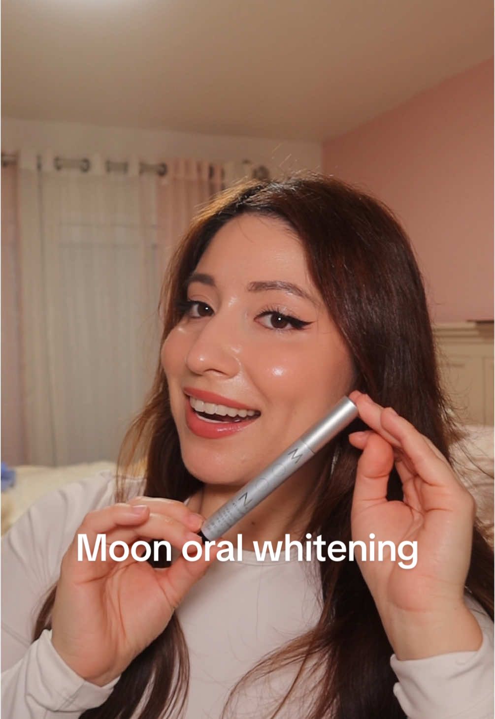 TikTok post by @emmecarrillo for MOON Oral Beauty. Caption reads: [...] or pain just whitening 🤍 @Moon Oral Beauty....