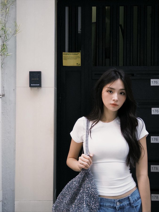 Instagram post by @katherine.he_ for Anteprima. Caption reads: A concrete jungle explorer🗿.