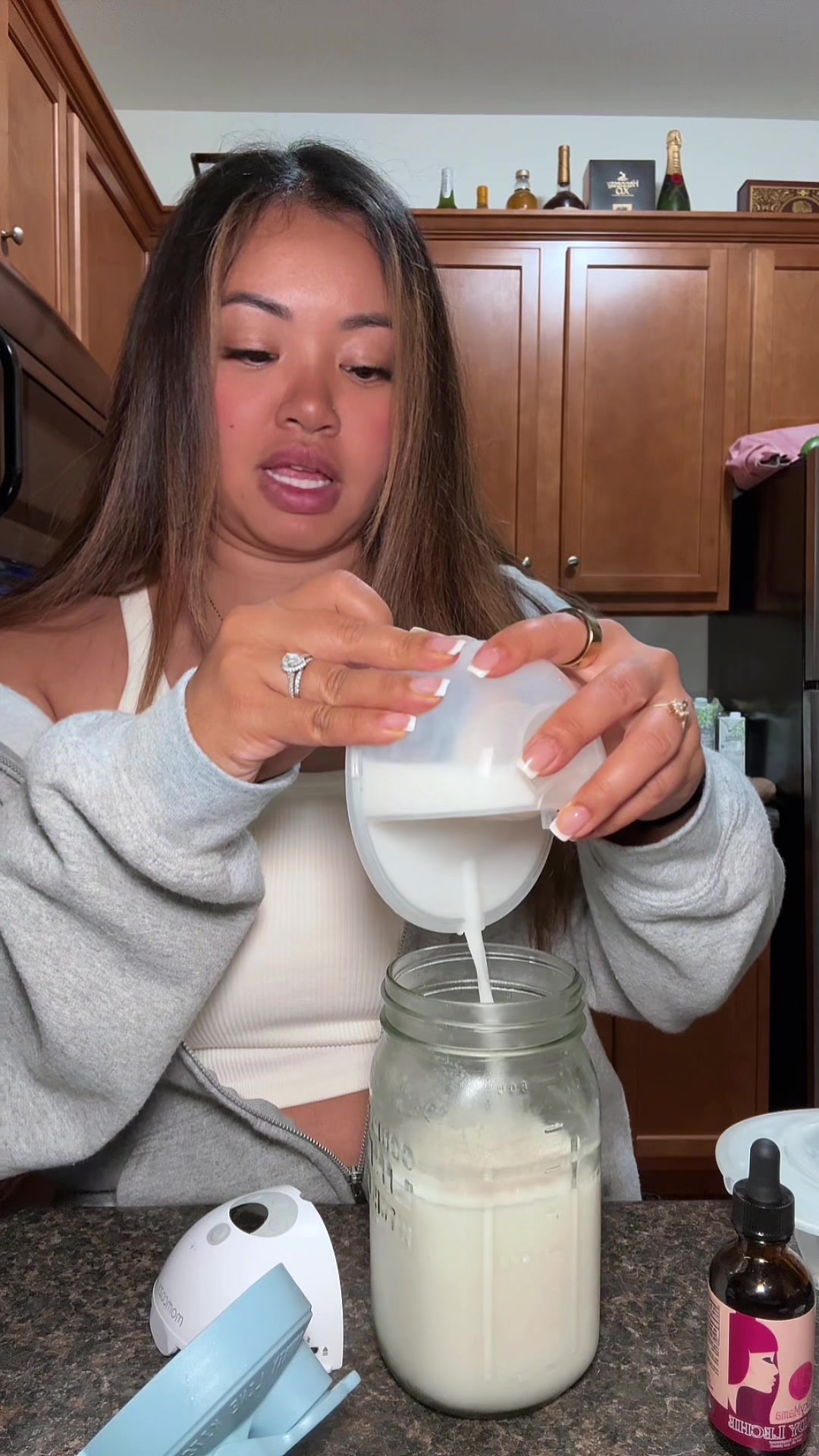 TikTok post by @xoxomonnie for Momcozy. Caption reads: [...] Mama Breastfeeding Help @Momcozy Official....