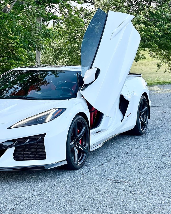 Instagram post by @missc8corvette for Vertical Doors Inc. Caption reads: Love how my Corvette C8 Z06 looks with vertical....