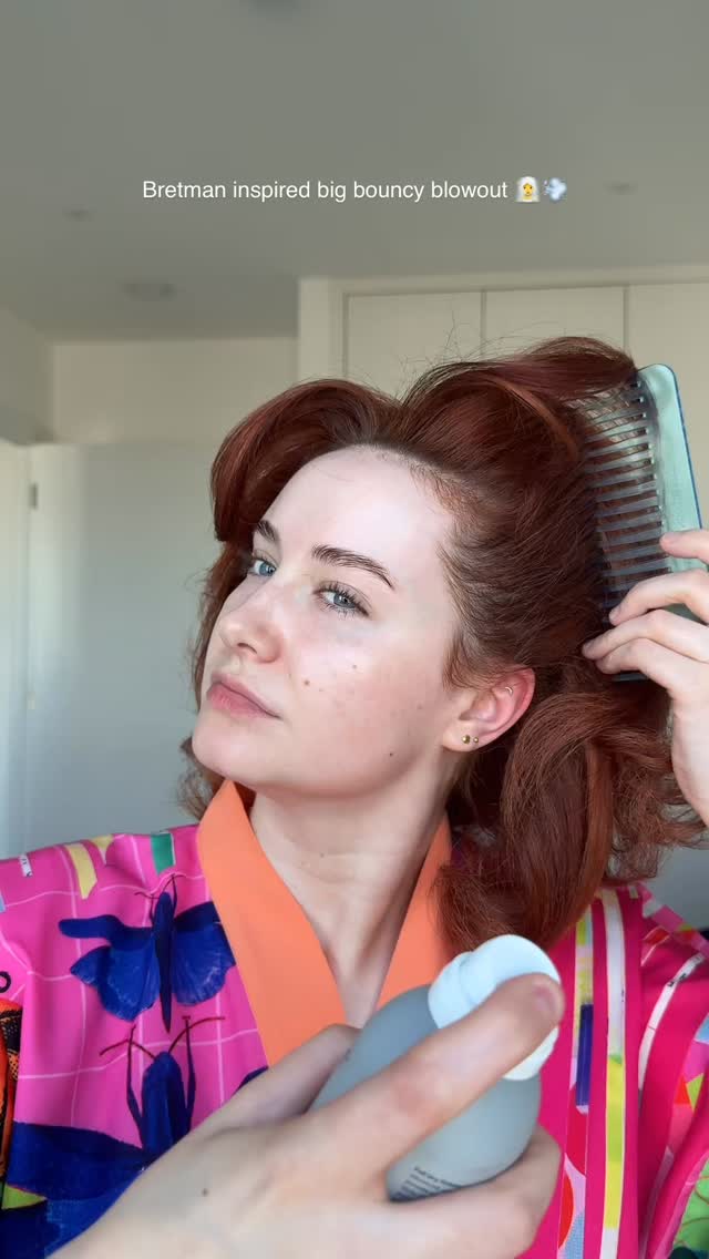 Instagram post by @youglowgrrl for ghd hair. Caption reads: @bretmanrock inspired big bouncy blowout....