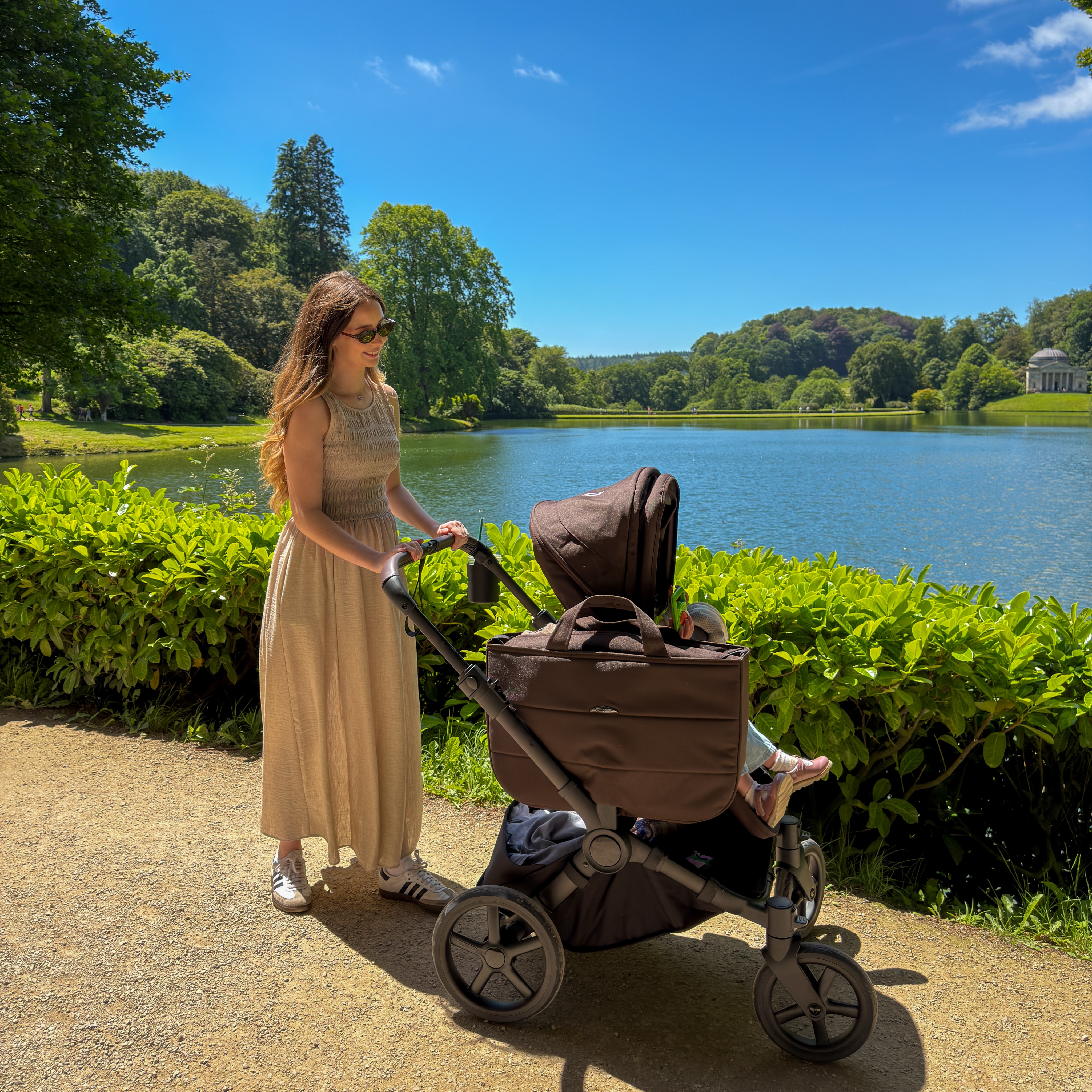 Instagram post by @anaisfletcher for Pramworld. Caption reads: sunny strolls with my loves 🤎🌤️👶🏻🌼 @pramworld....
