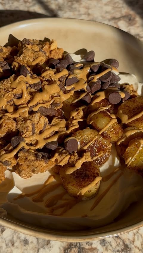 Instagram post by @wholesomelysophia for PBfit. Caption reads: [...] fave Greek yogurt ✨ caramelized banana ✨....