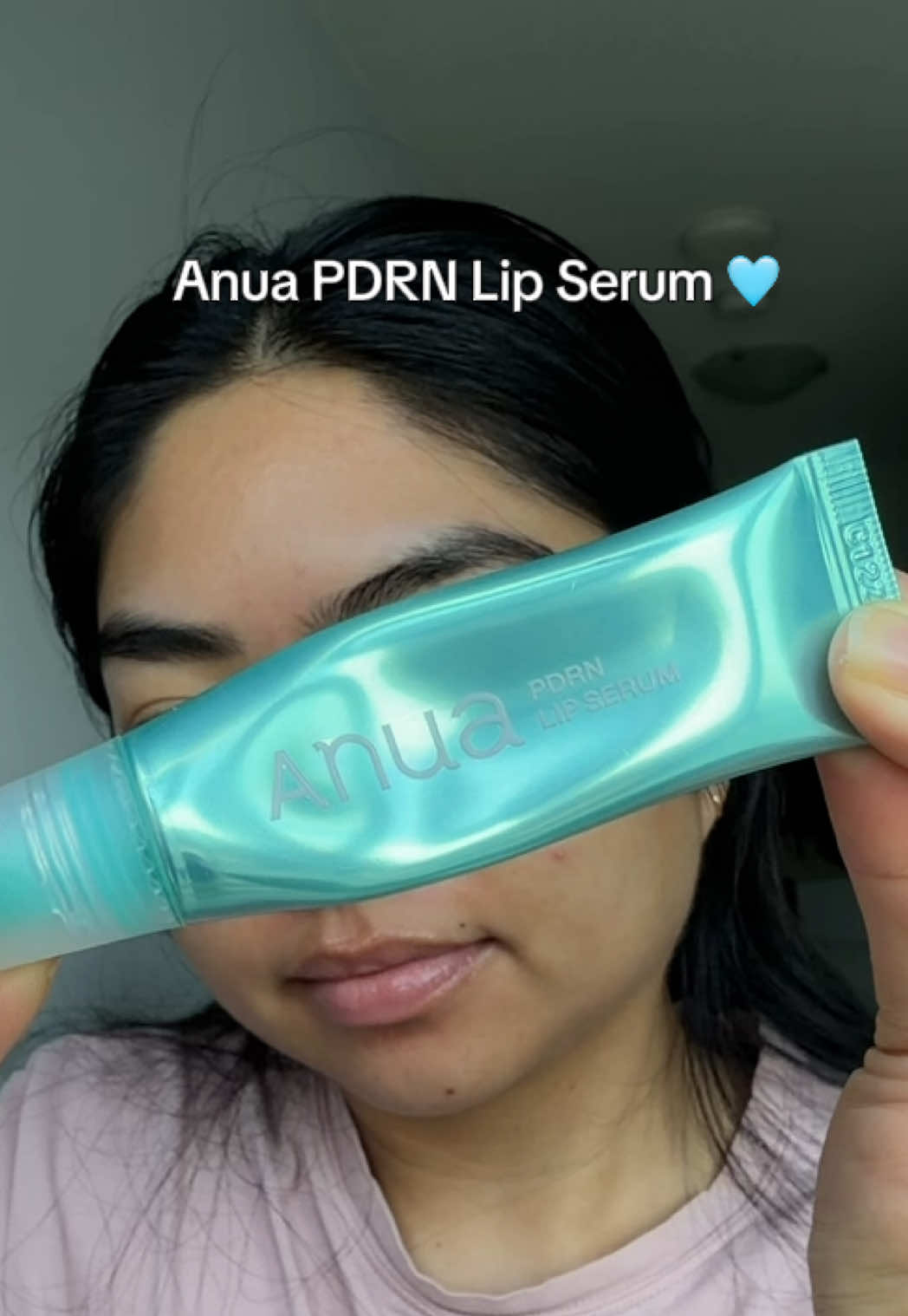 TikTok post by @michlopez.hjs for ANUA Skincare KR. Caption reads: Obsessed with how hydrated, smooth & glossy my....