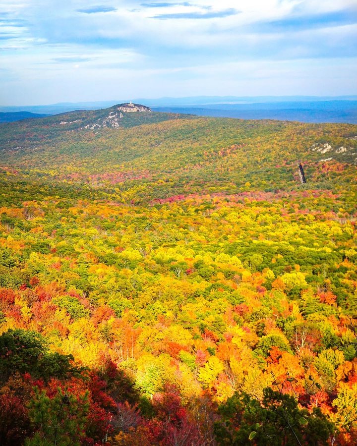 Instagram post by @lukekellytravels for National Geographic Travel. Caption reads: Fall colors at Minnewaska State Park, NY. Great....