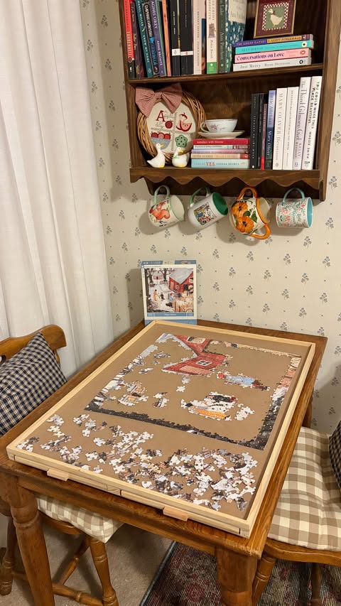 Instagram post by @intothecozycorner for All4JIG. Caption reads: [...] home to? 📝: This puzzle board is from....
