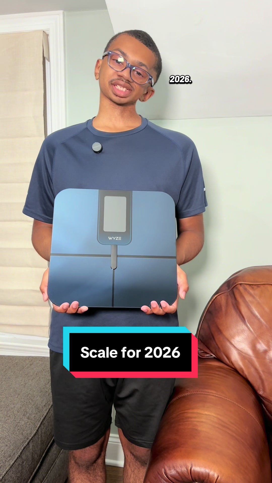 TikTok post by @the.quiet.hustler5 for Wyze. Caption reads: This scale shows your weight, muscle mass, and....