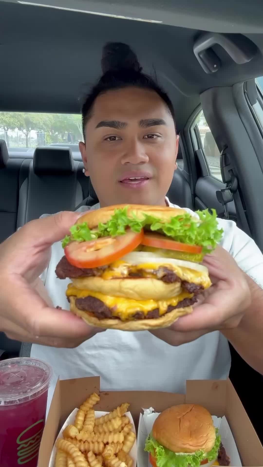 TikTok post by @natelovlogs for Shake Shack. Caption reads: Head over to @SHAKE SHACK to try the Big Shack!....