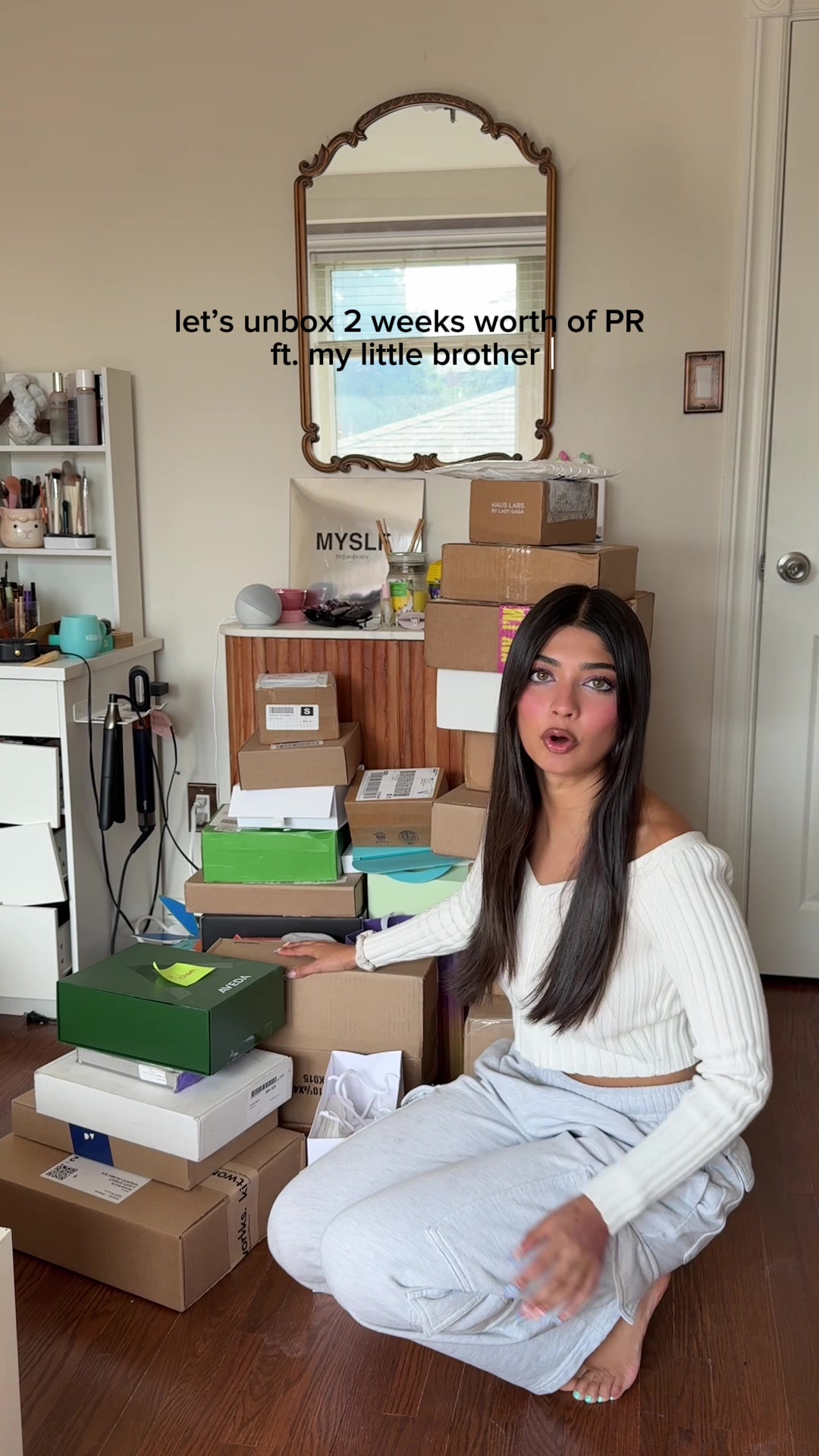 TikTok post by @mahammalek for Lilly Lashes. Caption reads: let’s unbox 2 weeks worth of PR ft. a surprise....