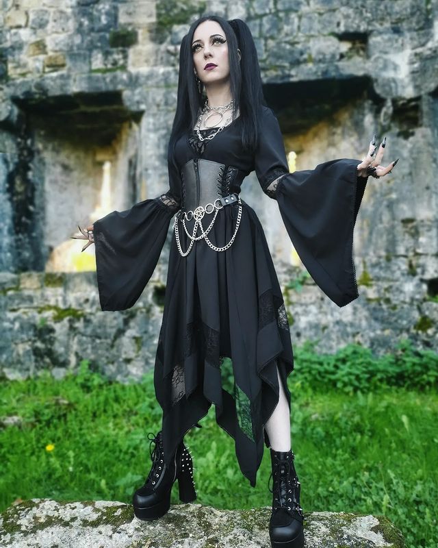 Instagram post by @kora_fitmetal for Demonia Shoes. Caption reads: How is your week going? 🖤✨ It's almost vacation....