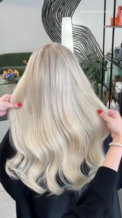Instagram post by @nicole__vincent for SalonCentric. Caption reads: [...] bright blonde using all Redken from....