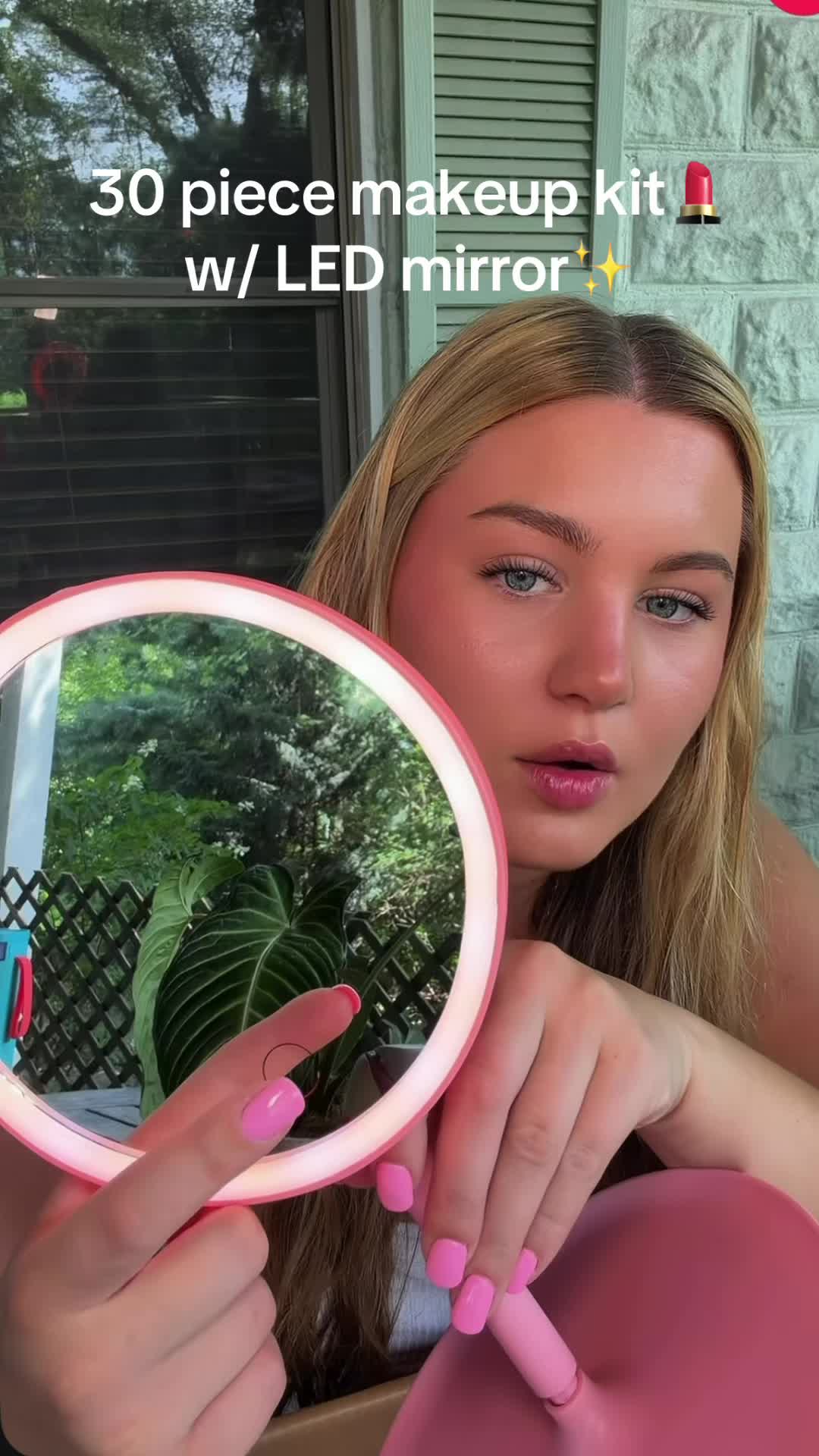 TikTok post by @lunaaleill for Kati Beauty NYC. Caption reads: the bag + mirror are perfect✨🌸 @Kati Beauty NYC....