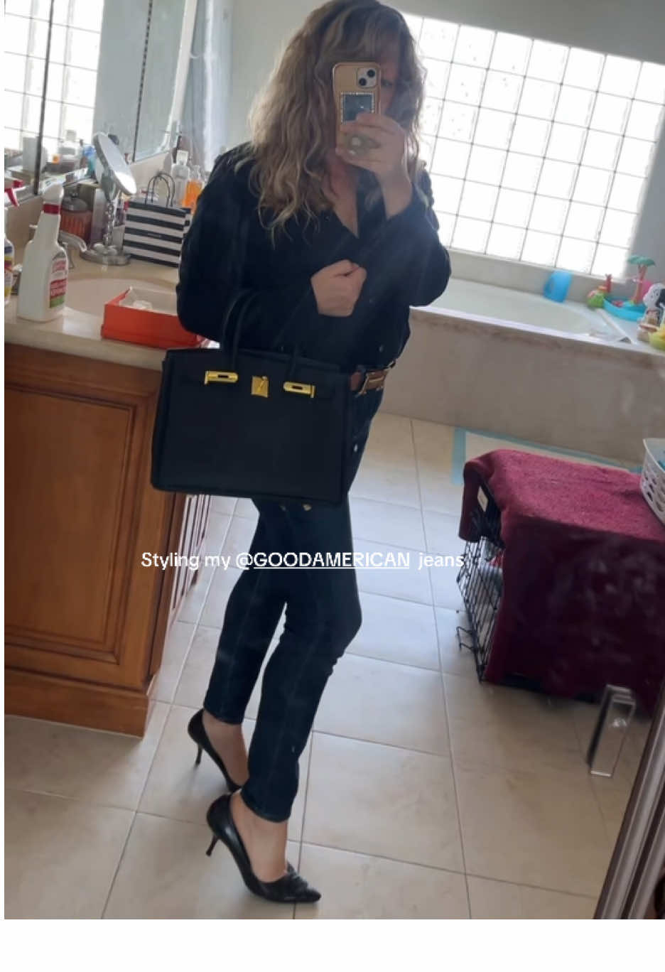 TikTok post by @beachtownmamacrown for GOOD AMERICAN. Caption reads: Styling my @GOOD AMERICAN good legs stretch jeans....