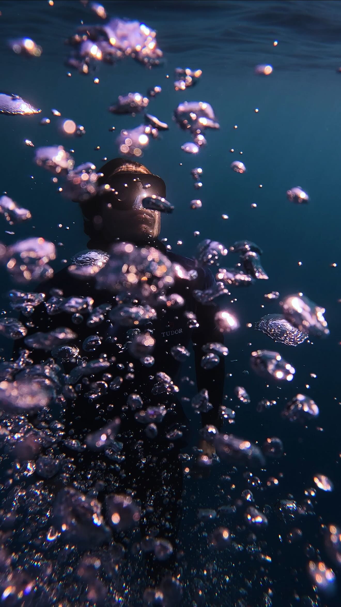 Instagram post by @alexboisset for Tudor Watch. Caption reads: [...] in freediving with @morganbourchis &....