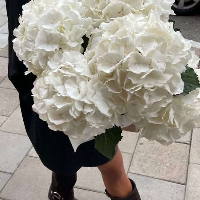 Instagram post by @andreabenhamou for KENZO Parfums. Caption reads: Happy mother’s day with Flower by Kenzo de....