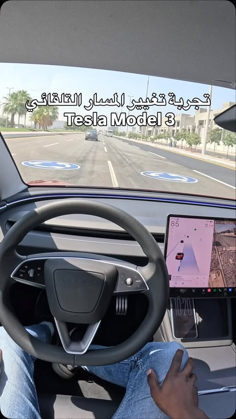 Instagram post by @c_ar99 for Tesla. Caption reads: ️ تجربة تغيير المسار التلقائي في Tesla Model 3....